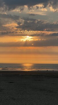 Golden sunset over Berck sur mer beach and calm sea