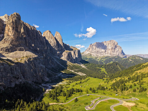 Panoramic Dolomites valley with winding mountain road
