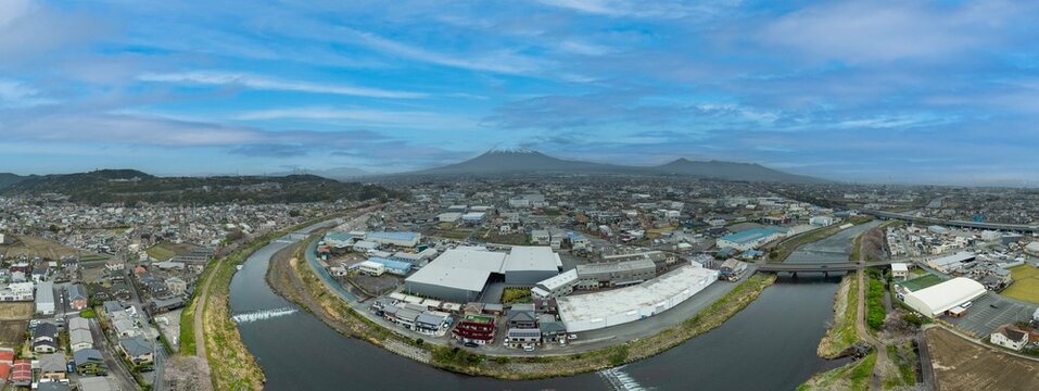 A panoramic view of Fujinomiya City with Mount Fuji in the background, Japan.