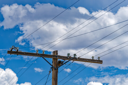 Antique glass insulators are still in use on a telegraph pole