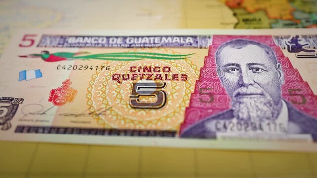 Guatemalan Five Quetzales Banknote Featuring Portrait and Bird Design