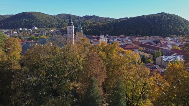 Aerial drone view of Banska Bystrica SNP Square and green hills
