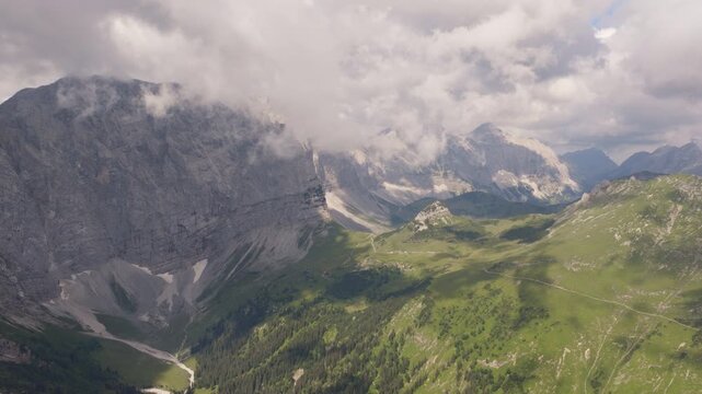 Dramatic aerial view of cloud-covered Karwendel Mountains above Eng Alm, Tyrol, Austria