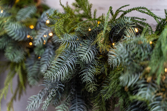 Christmas evergreen garland with warm fairy light glow