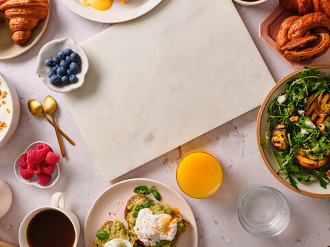 Avocado sandwich and grilled peach salad brunch setting
