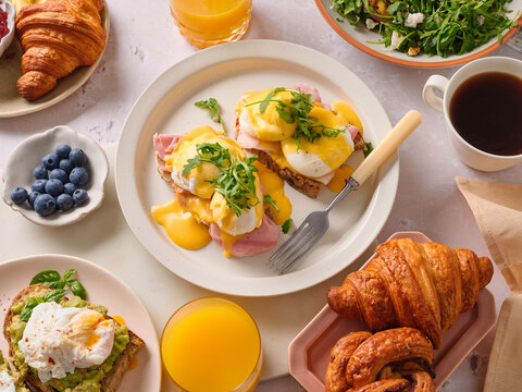 Delicious brunch spread with egg benedict and salad