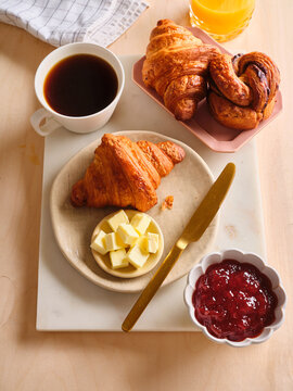 Breakfast breakfast with buttery croissants and coffee