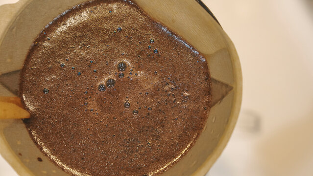 Coffee Grounds Blooming in Pour Over Dripper Top View