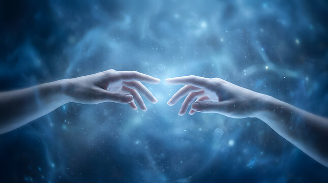 Two hands reaching to connect with magical glowing cosmic energy