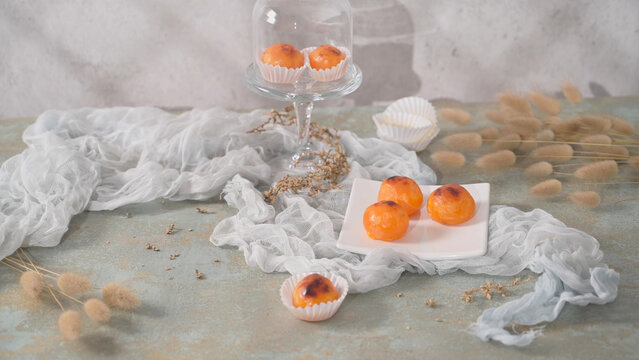 Portuguese egg sweets known as doces de ovos or toucinho do cielo in paper cups on a plate