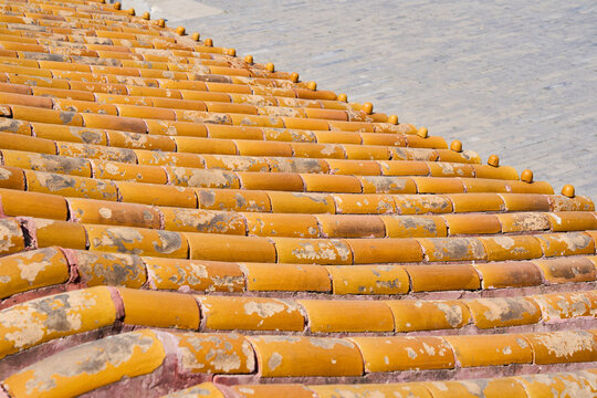 Weathered Terracotta Roof Tile Pattern with Rustic Mediterranean Architecture Texture Background