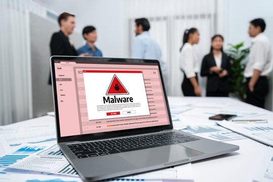 Cyber attacking concept. Malware alert showing on computer screen display scam and threat detection on computer system or online server to be removed brisk.