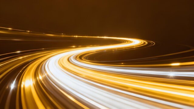 Golden light trails form a winding path against dark background capturing motion blur effect