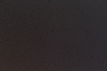 Obraz premium Fine water mist droplets on black background texture