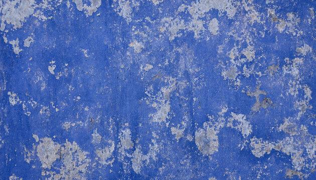 Peeling blue paint textured background with weathered concrete blue grunge texture background