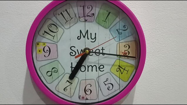 Colorful Pink Wall Clock With My Sweet Home Text On White Wall