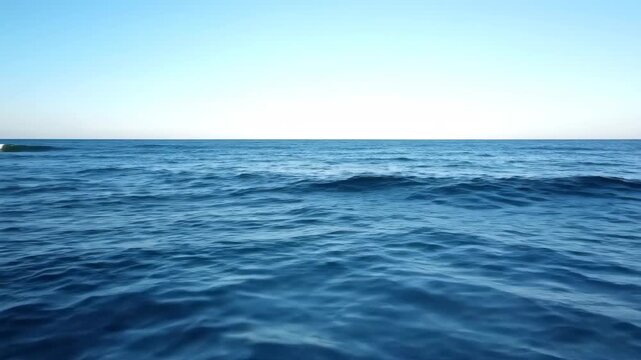 The vast natural landscape of the sea, with waves surging on the blue sea
