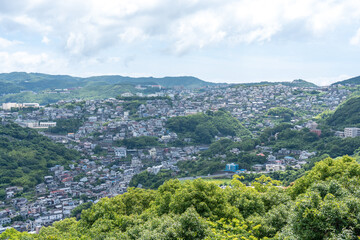 Fototapeta premium Wide Landscape of Nagasaki Sloped Residential Hills and Mountains