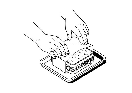 Hands wrap a fresh sandwich in paper on a metal tray, demonstrating professional food preparation and hygienic handling in a commercial kitchen environment.