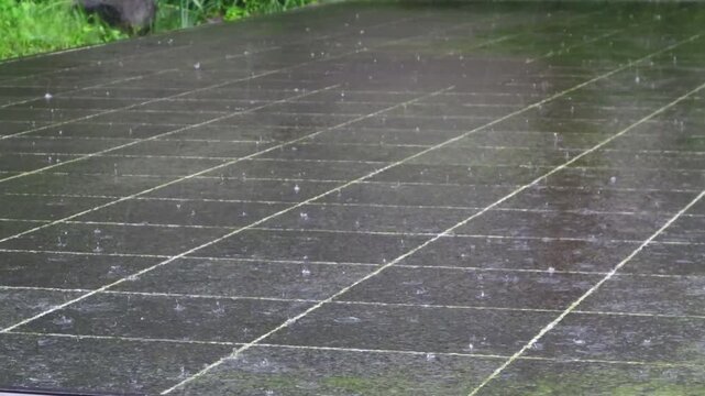 The summer monsoon rain falls on the stone ground.여름철 장맛비가 돌바닥위로 내립니다.