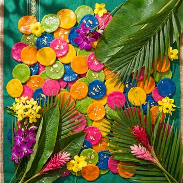 Vibrant Filipino Pahiyas festival display with colorful kiping rice wafers and blossoms