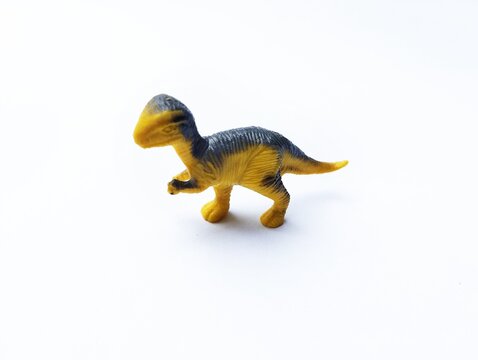A plastic dinosaur toy, likely a Corythosaurus or Parasaurolophus figurine.&nbsp;