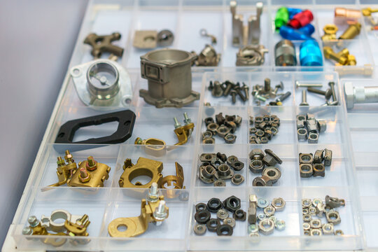 Assortment of Metal Hardware and Mechanical Parts in Organizer Box