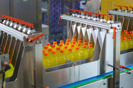 Automated Machine Sorting Yellow Beverage Bottles