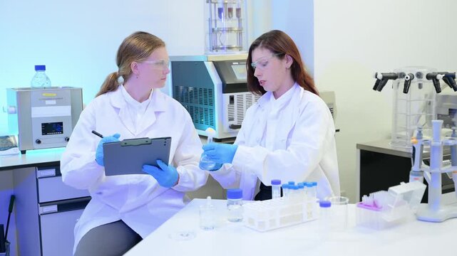 A scientific research team collaborating in a modern laboratory, conducting experiments, analyzing samples, and using advanced lab equipment