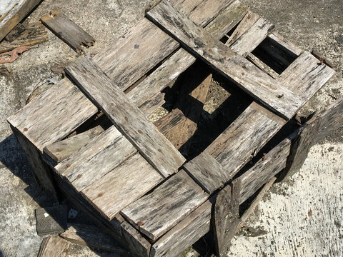 Old Weathered Wooden Pallet Crate on Concrete Floor Texture