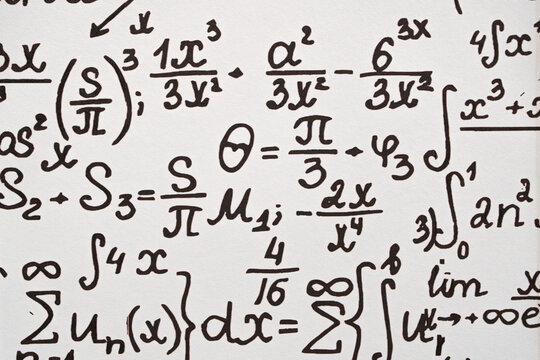 mathematical formulas, equations and geometric diagrams on chalkboard