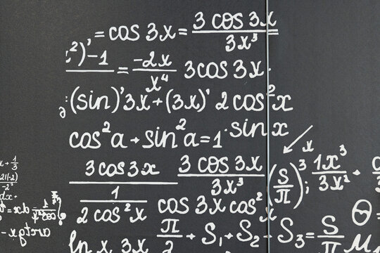 mathematical formulas, equations and geometric diagrams on black chalkboard