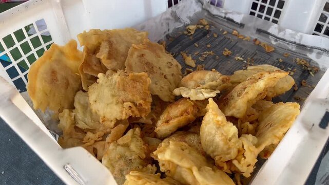Extreme close up of freshly cooked crispy Indonesian stuffed tofu tahu isi
