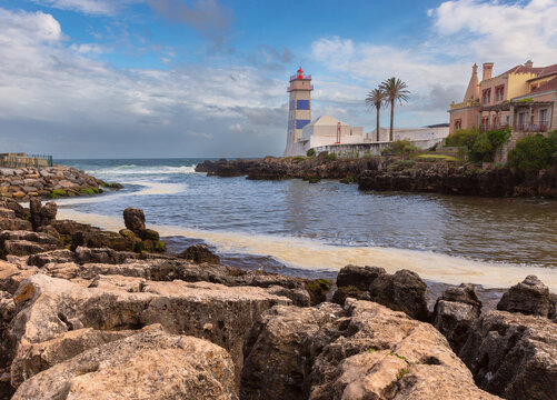 Santa Marta Lighthouse and Rocky Coastline in Cascais, Portugal