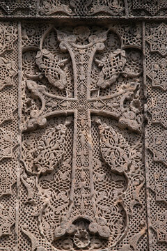 Macro texture of medieval Armenian khachkar carved cross details at Goshavank monastery