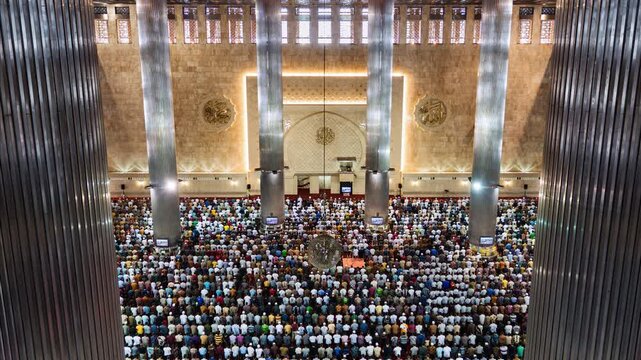 Asia, Indonesia, Jakarta, time lapse of Jakarta's Istiqlal mosque, with Muslims praying during Friday mass prayer. 