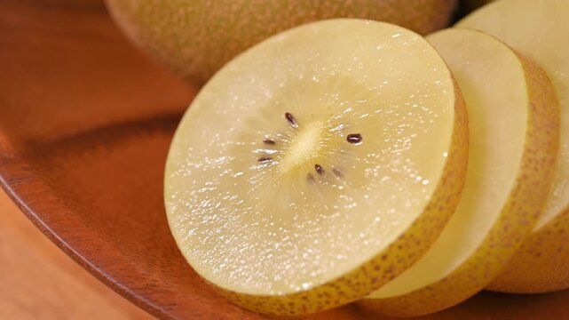 Fresh Yellow Kiwifruit in Wooden Bowl