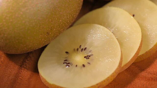 Fresh Yellow Kiwifruit in Wooden Bowl
