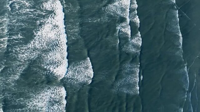 Drone view of blue water background with beautiful wave formation, sea view Karachi 