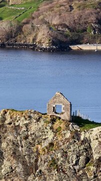Aerial view of the remaining wall of the old coastguard station in Teelin, County Donegal, Ireland