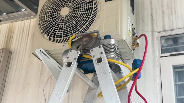 installing an air conditioner and calibrating the AC measuring instruments and vacuum pump