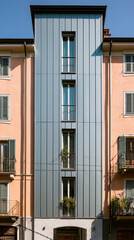 Obraz premium Modern Apartment Facade with Vertical Metal Cladding