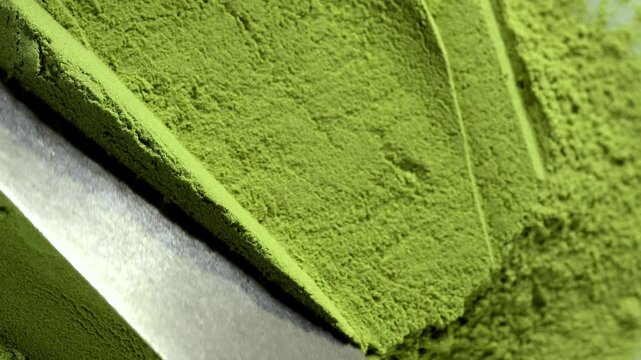 Matcha green tea powder close up, dry green powder texture, detox superfood concept, healthy lifestyle. Moringa, Spirulina, chlorella superfoods