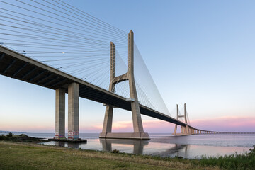 Fototapeta premium Europe's longest bridge Ponte Vasco da Gama cable-stayed bridge over Tagus River in Lisbon, Portugal