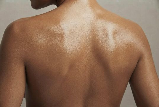 Close Up View of Smooth Glowing Back and Shoulder Skin on Woman