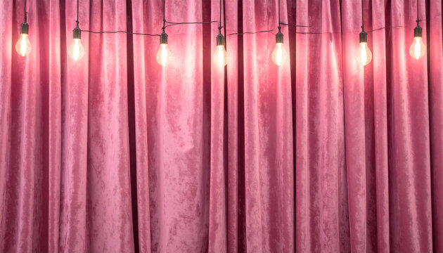 Pink velvet curtain with string lights creating warm mood and soft texture