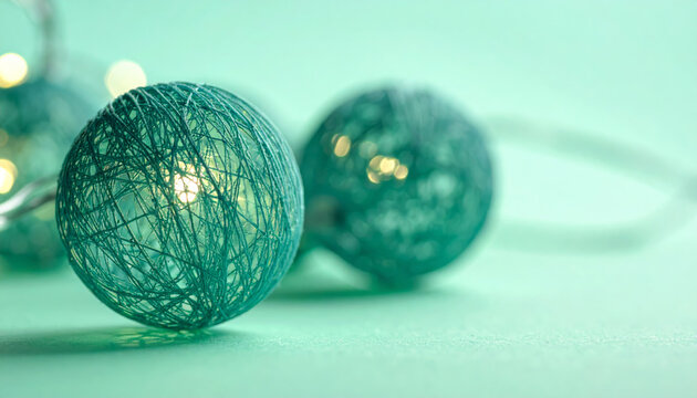 Teal string ball light teal string ball decorative light cotton ball light bokeh soft glow festive decor pastel background close up home decoration