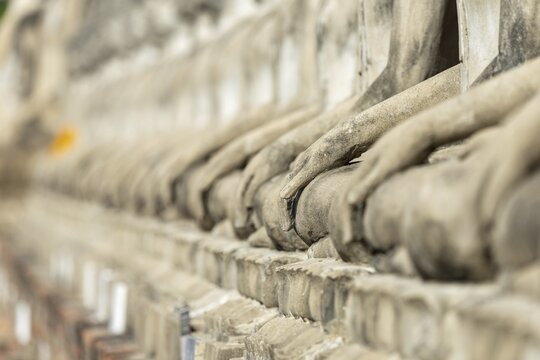 Row of Buddha statues (Bhumispara-mudra, Buddha Gautama at the moment of enlightenment), Great Chedi Chaya Mongkol, Wat Yai Chai Mongkon, Ayutthaya, Thailand