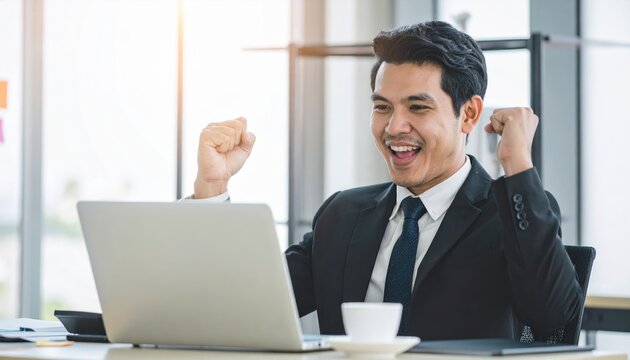 Businessman celebrating successful project completion