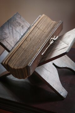 Ancient palm leaf writings on Ayurvedic themes lie on a wooden stand, Harivihar Ayurvedic Heritage Home, Bilathikulam, Calicut, Kerala, South India, India